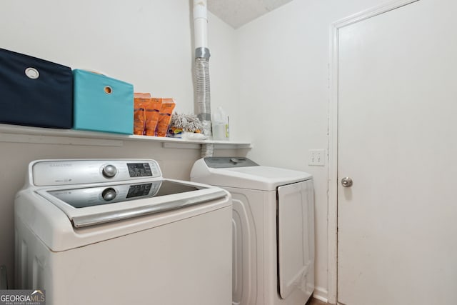 laundry area featuring washing machine and dryer