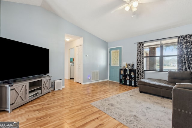 living room featuring lofted ceiling, wood-type flooring, and ceiling fan