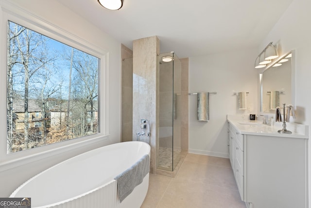 bathroom featuring tile patterned flooring, vanity, and separate shower and tub