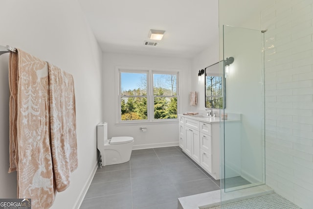 bathroom featuring vanity, tile patterned floors, toilet, and tiled shower