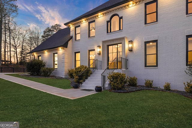 view of front of property with a yard