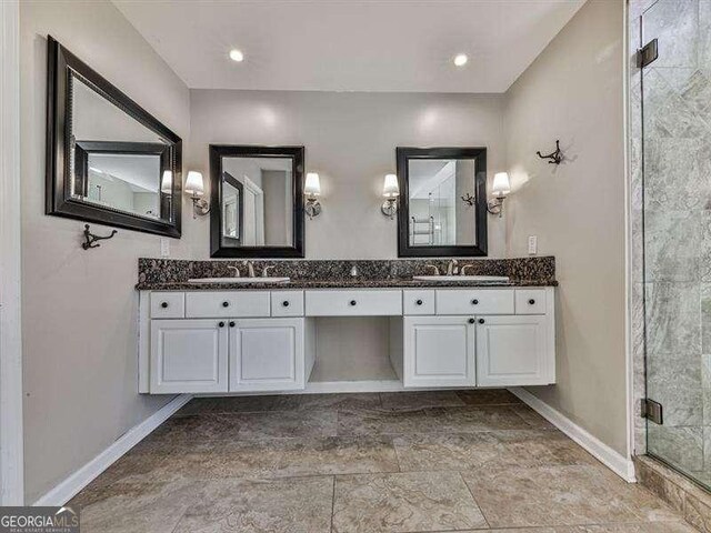 bathroom featuring vanity and walk in shower