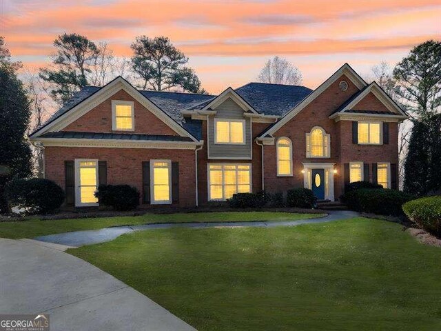 view of front of home with a yard
