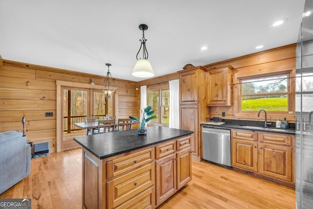 kitchen featuring dishwasher, a center island, pendant lighting, and a wealth of natural light