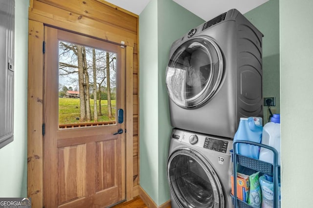 washroom featuring stacked washer and dryer