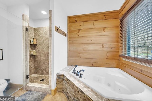 bathroom featuring plus walk in shower and tile patterned flooring