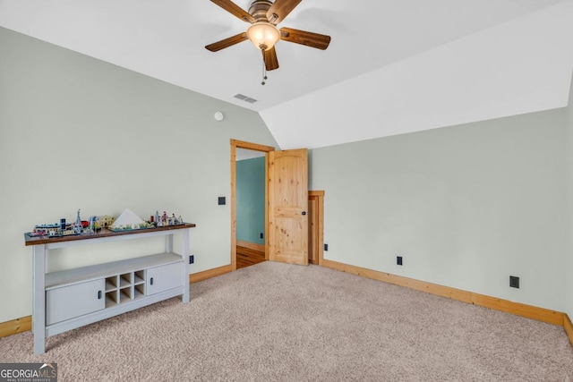 interior space featuring vaulted ceiling and ceiling fan