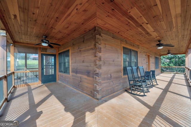 wooden deck with ceiling fan and covered porch