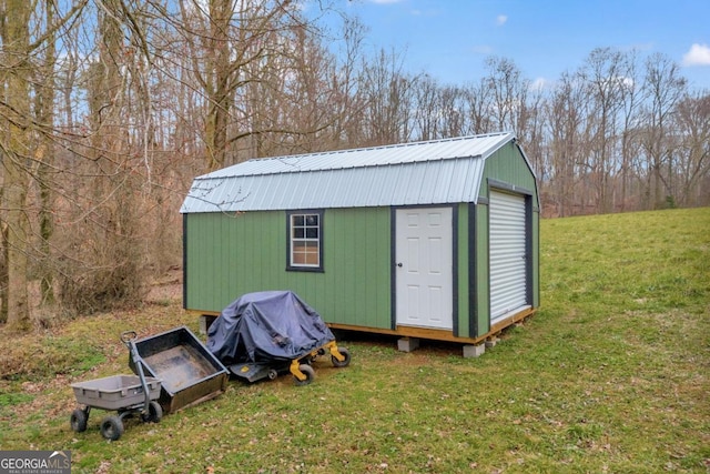 view of outdoor structure with a yard