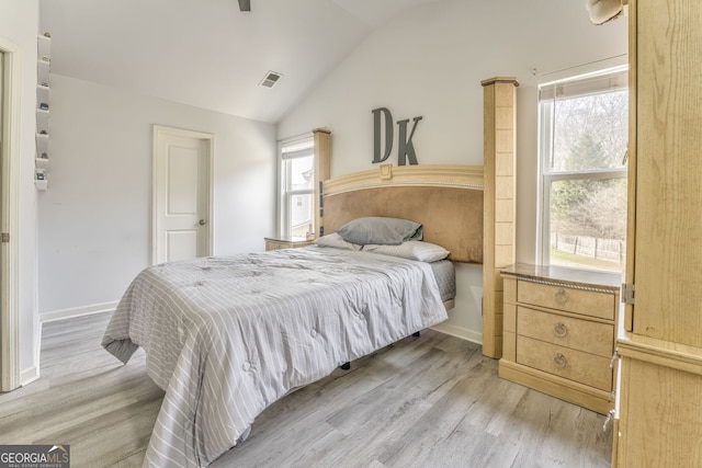 bedroom featuring vaulted ceiling and light hardwood / wood-style floors