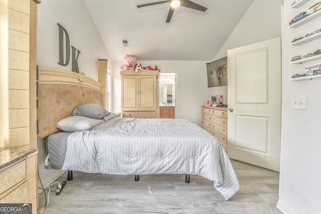 bedroom featuring ceiling fan, lofted ceiling, and light wood-type flooring