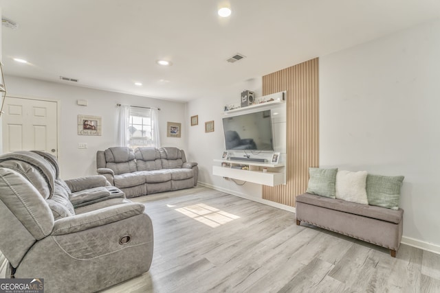 living room with light hardwood / wood-style floors