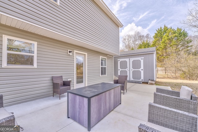 view of patio with a storage shed and an outdoor hangout area