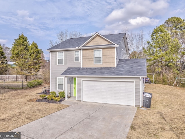 front of property featuring a garage and a front lawn