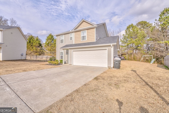 view of front property with a garage and a front lawn