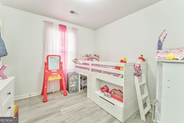 bedroom with light hardwood / wood-style flooring