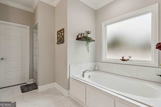 bathroom featuring crown molding and a tub