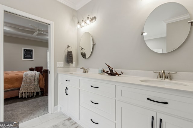 bathroom featuring vanity, ornamental molding, and ceiling fan