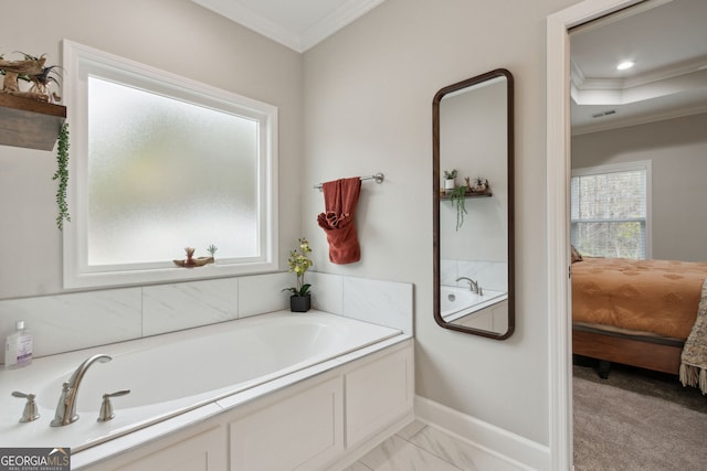 bathroom featuring ornamental molding and a tub