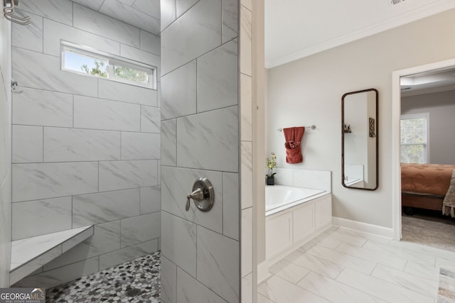 bathroom with ornamental molding and separate shower and tub