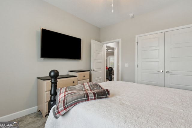 carpeted bedroom featuring a closet