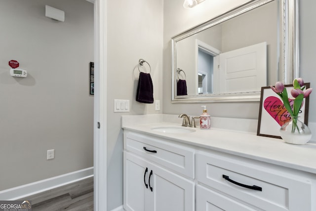 bathroom featuring hardwood / wood-style flooring and vanity