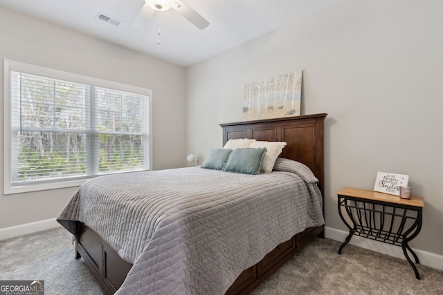 bedroom with ceiling fan and light carpet