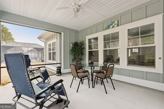 sunroom featuring ceiling fan