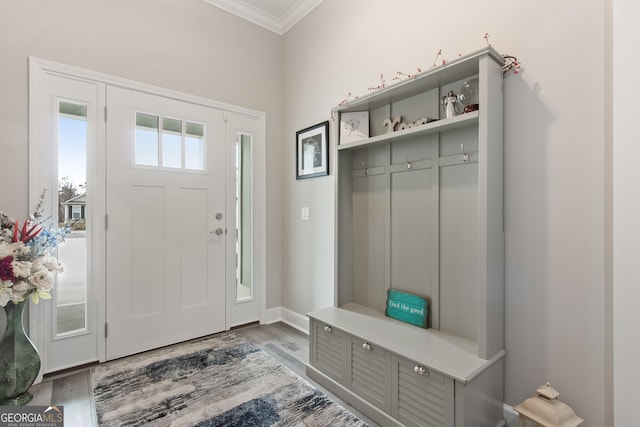 mudroom featuring hardwood / wood-style flooring and ornamental molding