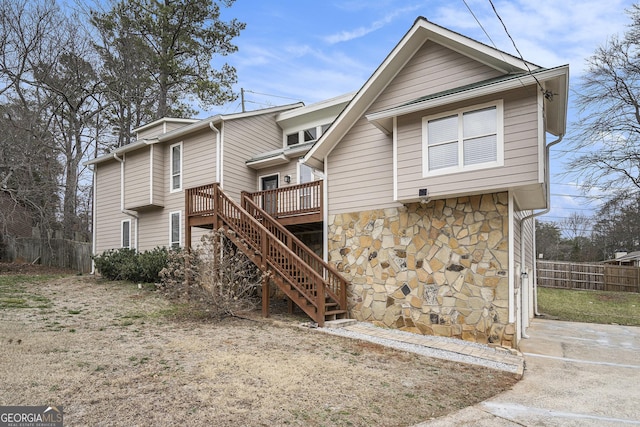 rear view of property with a deck