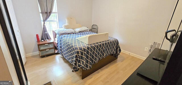 190 Creekwood Rd, Winder, GA 30680 - bedroom with baseboards and wood finished floors