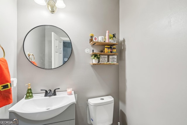 bathroom with vanity and toilet