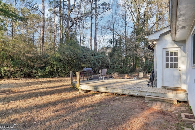 view of yard with a wooden deck