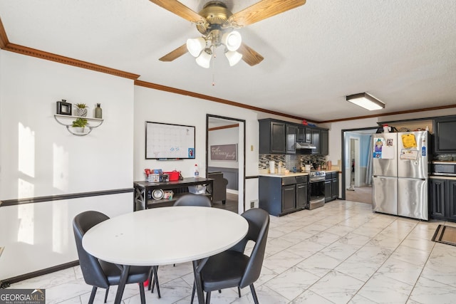 dining area with crown molding, ceiling fan, and a textured ceiling