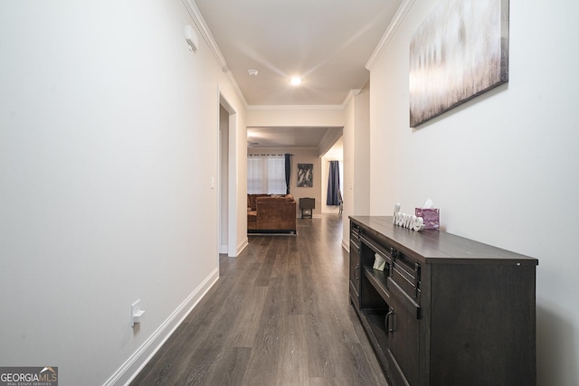 corridor with crown molding and dark hardwood / wood-style floors