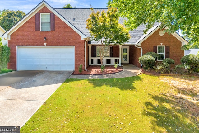 view of front of home featuring a garage, a porch, and a front yard