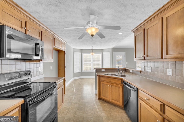 kitchen with sink, backsplash, electric range, a textured ceiling, and stainless steel dishwasher