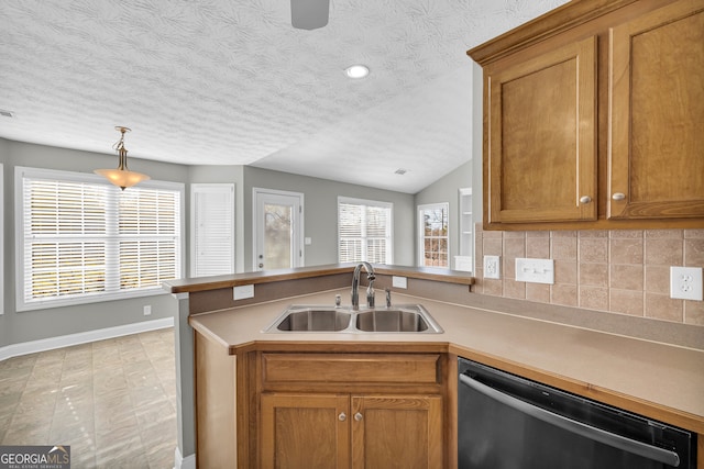 kitchen with sink, hanging light fixtures, tasteful backsplash, stainless steel dishwasher, and kitchen peninsula