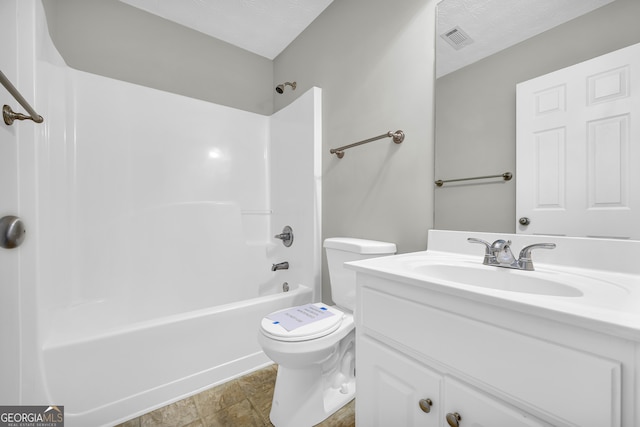 full bathroom featuring vanity, a textured ceiling,  shower combination, and toilet