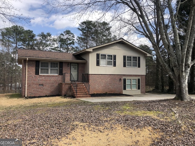 tri-level home featuring a patio