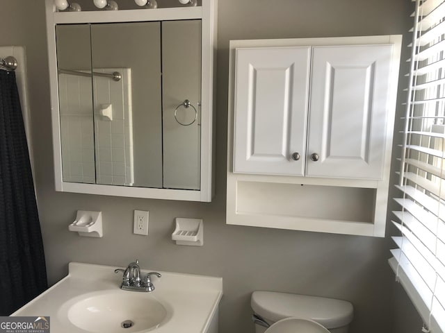 bathroom featuring sink and toilet