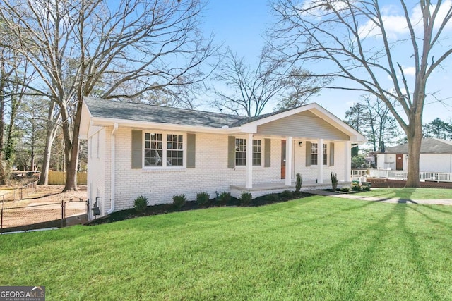 single story home with a front yard and a porch