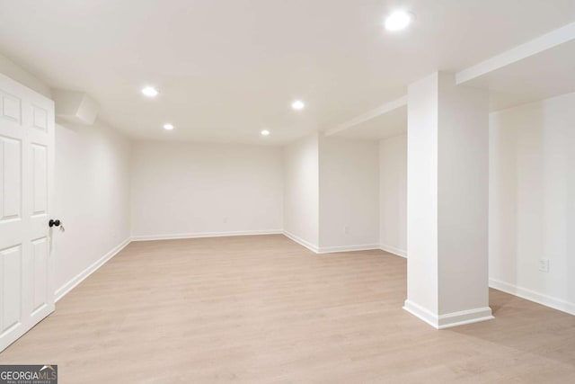 basement featuring light hardwood / wood-style floors