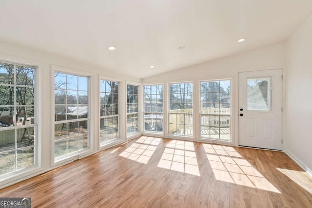 unfurnished sunroom with vaulted ceiling