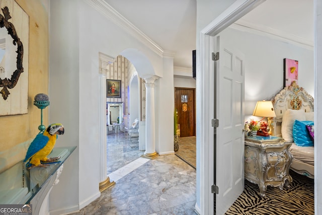 hall featuring crown molding and ornate columns