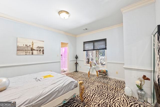 bedroom featuring crown molding and carpet floors