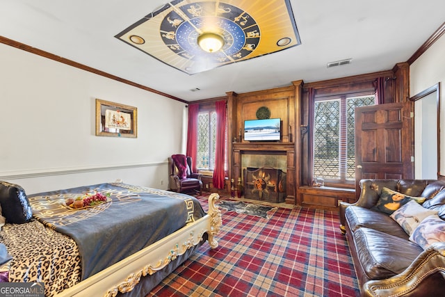 carpeted bedroom with crown molding, a fireplace, and multiple windows