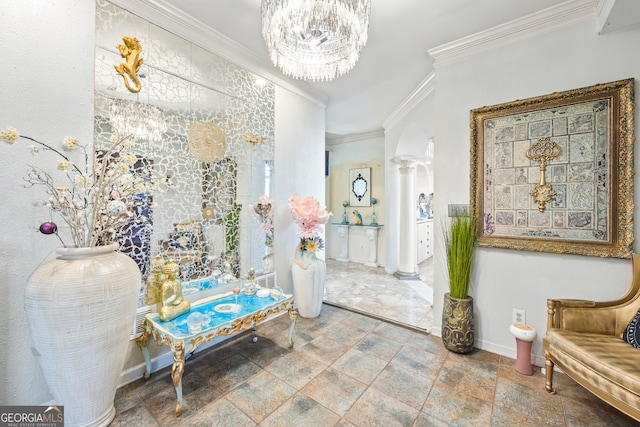 interior space featuring crown molding, an inviting chandelier, and ornate columns