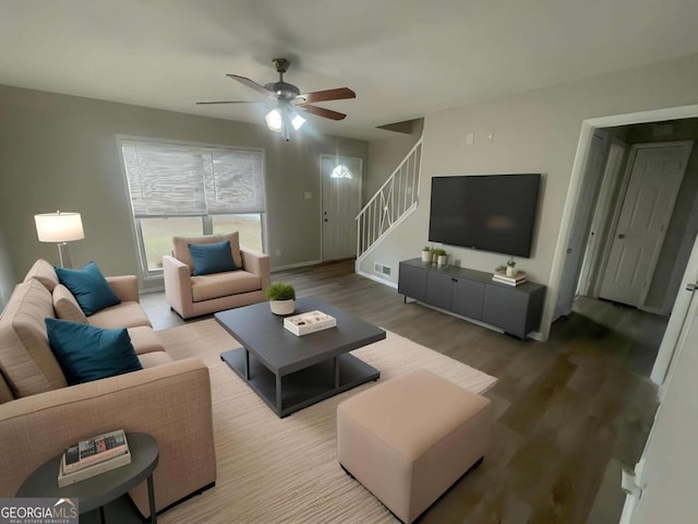 living room with hardwood / wood-style floors and ceiling fan