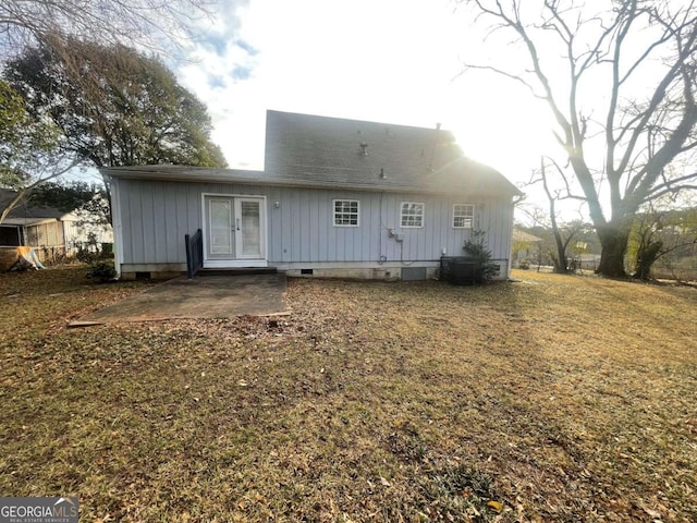 back of house with a patio, central AC, and a lawn